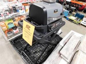 lot 228 image: NINJA Woodfire Outdoor Grill & Smoker, 7-in-1 Master Grill, BBQ Smoker and Air Fryer for Backyard and Camping in Gray with stand
