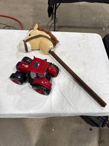 lot 0582 image: Stick Horse and Toy Tractor