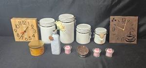 lot 22 image: Home Decor Lot with 2 Wall Clocks, Ceramic Canisters, Candles, and Vase