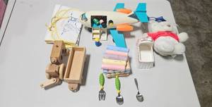 lot 27 image: Childrens Toy and Decor Collection with Wooden Vehicles, Chalk, Fisher-Price Airplane, and Plush Bear