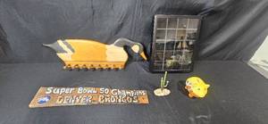 lot 64 image: Decorative Collectibles Lot with Denver Broncos Sign, Wood Goose Rack, Arizona Piggy Bank, Miniature Cactus, and Shadow Box