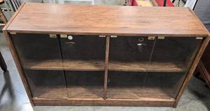 lot 236 image: Wood Display Cabinet with Glass Sliding Doors 50x16x29 in