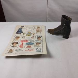 lot 83 image: Vintage Cast Iron Door Stop Boot � Vintage Ad for Little Things that girls Love