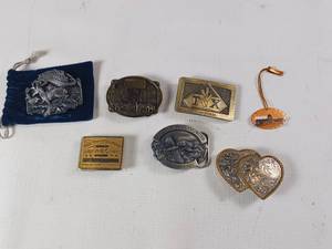 lot 132 image: Lot of Vintage Belt Buckles - Silver Plate - Fresh Pork - Trojan Hybrids - Ducks Unlimited