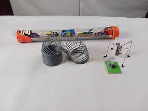 lot 165 image: Fun Toys Lot - SLinky, cars and shaky bug wind up toy with key