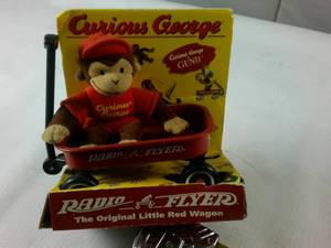 lot 219 image: Curious George Doll with Radio Flyer Wagon