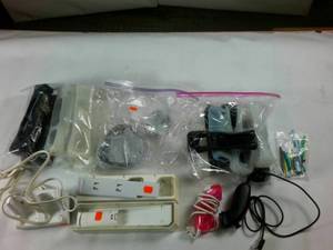 lot 255 image: Lot of WII Accessories � Silicone covers � 2 numchucks � 2 remote charges � pack of stylus