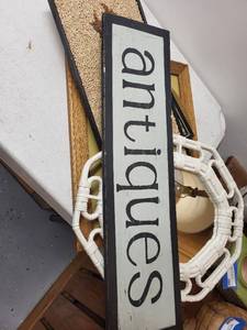 lot 298 image: Vintage Wall Decor Lot with Wicker Mirror, Framed Art, and Antique Sign