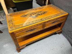 lot 43 image: Hand-Carved Wooden Coffee Table with Glass Top and Storage Shelf