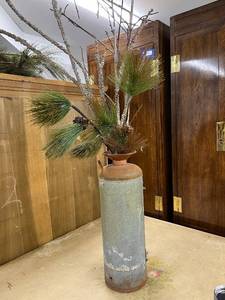 lot 84 image: Vintage Metal Milk Can with Pine Branch Arrangement