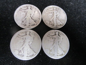 lot 59 image: Four Walking Liberty Half Dollars