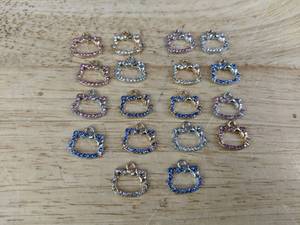 lot 166 image: 18 Hello Kitty-Inspired Charms - Brand New