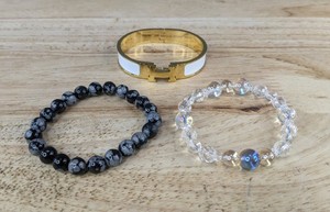 lot 520 image: White Enamel Gold-Tone Cuff, Black Gray Beaded Bracelet, and Clear Crystal Beaded Bracelet - Brand New