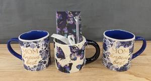 lot 572 image: 2 Mom Knows Best Mugs 13.5 oz & Butterfly Mug 14.2 oz with Notebook Set - Brand New