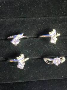 lot 15 image: 4 Stainless Steel Fashion Rings with CZ Stones - Size 6.25 to 7.25