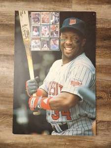 lot 242 image: Poster of Hall of Fame baseball player Kirby Puckett and a collection of nine Kirby Puckett baseball cards.