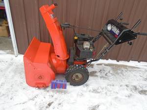 lot 100 image: Ariens 8524 Snow blower with electric start. Used condition. Tested & works. As shown. THIS ITEM HAS A RESEVRE.