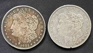 lot 6 image: Pair of 1921 Mogan Silver Dollars