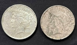 lot 9 image: Pair of 1923 Peace Dollars