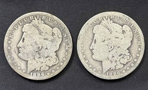 lot 26 image: Pair of 1886-O Morgan Silver Dollars