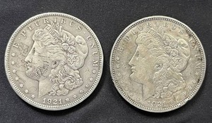 lot 31 image: Pair of 1921 Mogan Silver Dollars