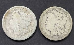 lot 32 image: Pair of 1897-O Morgan Silver Dollars