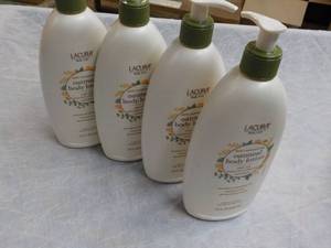 lot 197 image: 4 Lacura 18 oz Bottles Oatmeal Body...