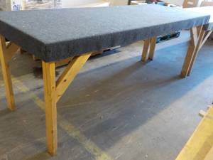 lot 01 image: 8 Foot long carpet top work counter, 36 high, very sturdy perfect for multi use shop space