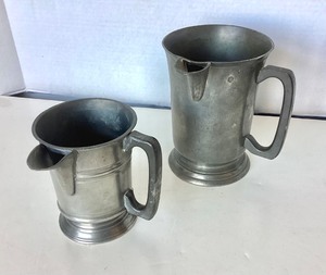lot 12 image: Pair of Antique English Pewter Measures  Pitchers