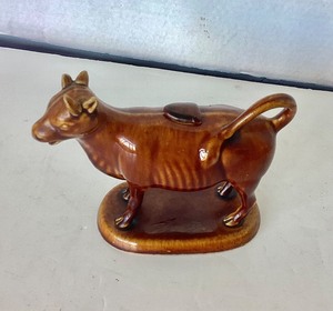 lot 80 image: Antique Rockingham Figural Cow Creamer