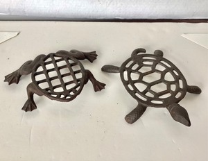 lot 214 image: Pair of Antique Figural Trivets