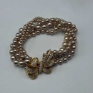 lot 100 image: Nolan Miller Costume Jewelry Lot  Necklace, Three Pairs of Earrings, and Pendants