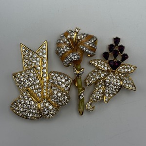 lot 104 image: Nolan Miller Costume Jewelry Lot  3 Brooches & 1 Pair of Earrings (4 Pieces Total)