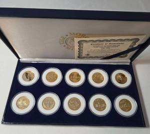 lot 25 image: 1999-2000 Ten Statehood Quarter Dollars  24 Karat Gold Plated Edition  (PA,DE,NJ.GA,CT,MA,MD,NC,NH,VA)
