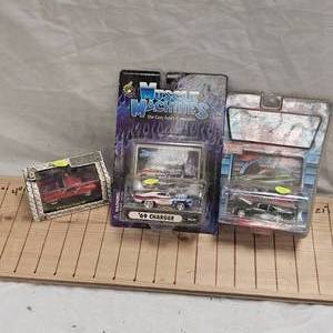 lot 115 image: Muscle Machine 1969 Charger, Pro Rodz 1970 Chevy Nova, Ground Pounders, 1970 Couger XR7, as New