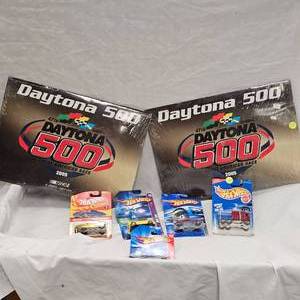 lot 74 image: 2-2005 Like New Daytona 500 Calendars and 5 Like New Hot Wheels
