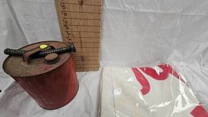 lot 24 image: Marlboro Towl(Still in Package unopened) and Vintage Gas Can