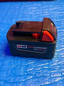 lot 25 image: Milwaukee M18 Red Lithium XC5.0 - 2025 date code