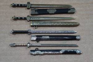 lot 266 image: Ornate Mini Metal Sword Set with Scabbards