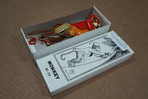 lot 304 image: Vintage Stlye Tin Litho Climbing Monkey