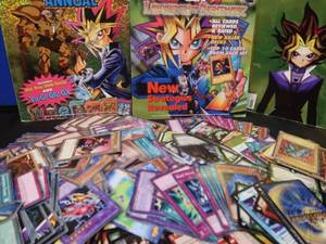 lot 12 image: YU-GI-OH CARDS AND BOOKS