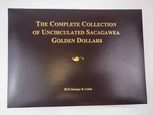 lot 307 image: Decorative Collectors Folder with 6 Uncirculated Sacagawea dollar coins and vintage stamps
