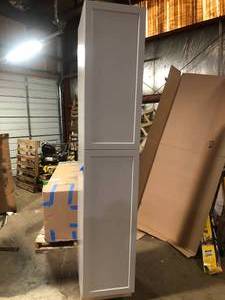 lot 30 image: Hampton Bay Designer Series Melvern 18 in. W x 24 in. D x 96 in. H Assembled Shaker Tall Pantry Kitchen Cabinet in Heron Gray damaged back customer return see pictures