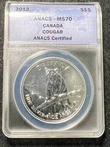 lot 03 image: 2012 CANADIAN COUGAR 1 TROY OZ .9999 FINE SILVER ANACS MS70