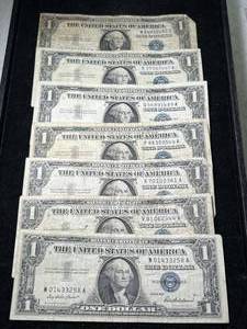 lot 67 image: 7 US BLUE SEAL $1 SILVER CERTIFICATES