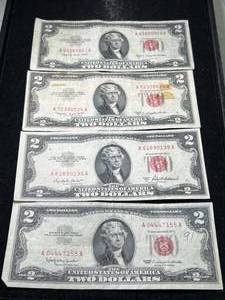 lot 69 image: 4 US RED SEAL $2 BILLS