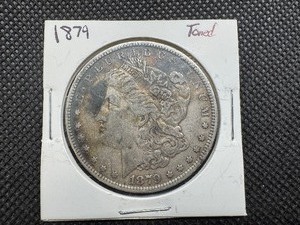 lot 3 image: 1879 Toned Morgan Silver Dollar