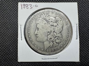 lot 7 image: 1883 O Morgan Silver Dollar