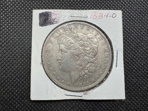 lot 8 image: 1884 O Morgan Silver Dollar