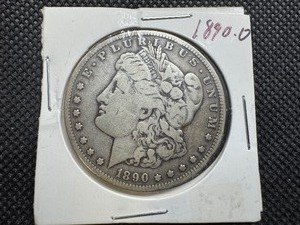 lot 17 image: 1890 O Morgan Silver Dollar